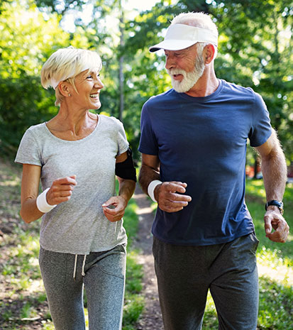 Healthy Seniors Running and Smiling