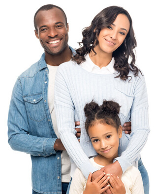 Happy couple holding child and smiling